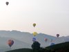 Balloons in the haze over the Barolo vineyards